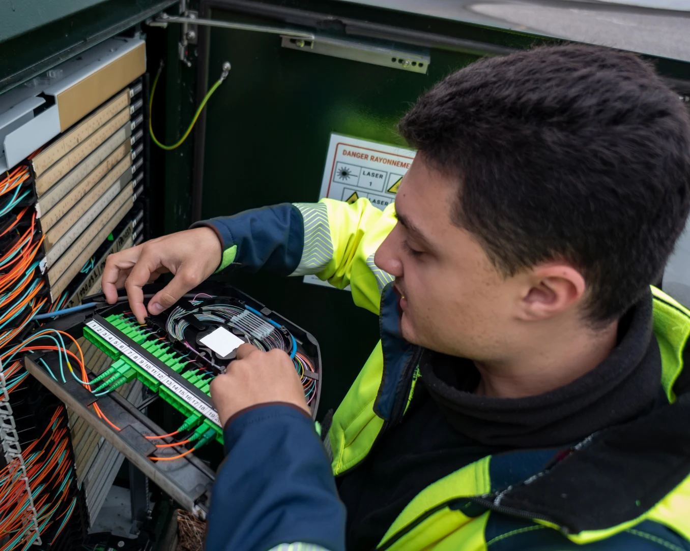 Engineer fixing network cables